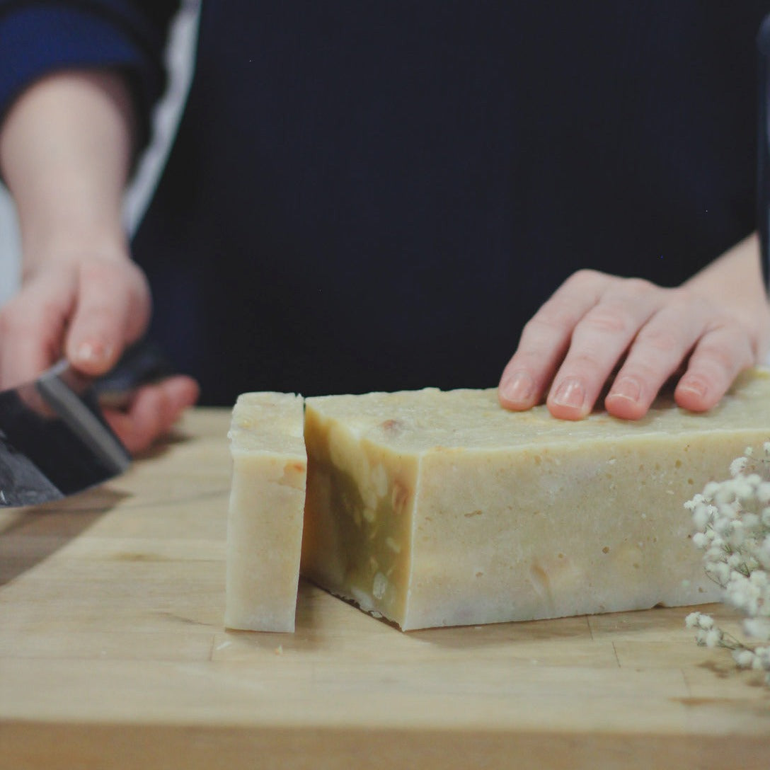 freshly cut scrappy soap on wood cutting board
